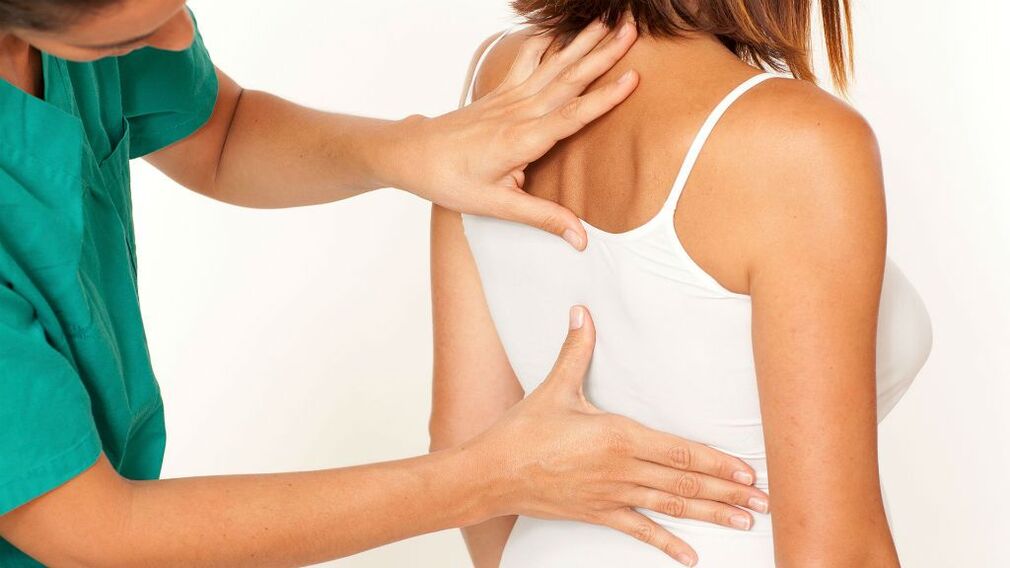 Doctor checks chest for osteochondrosis